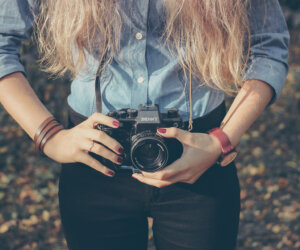 Woman with vintage retro camera Woman with vintage retro camera